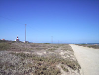 Looking back along the gravel road from the turn off towards the LIght House
